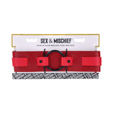 Sex & Mischief Exs & Ohs Bound and Belted bondage restraint in red faux leather with packaging.