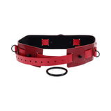 Sex & Mischief Exs & Ohs Bound and Belted restraint belt featuring faux leather and red accents.