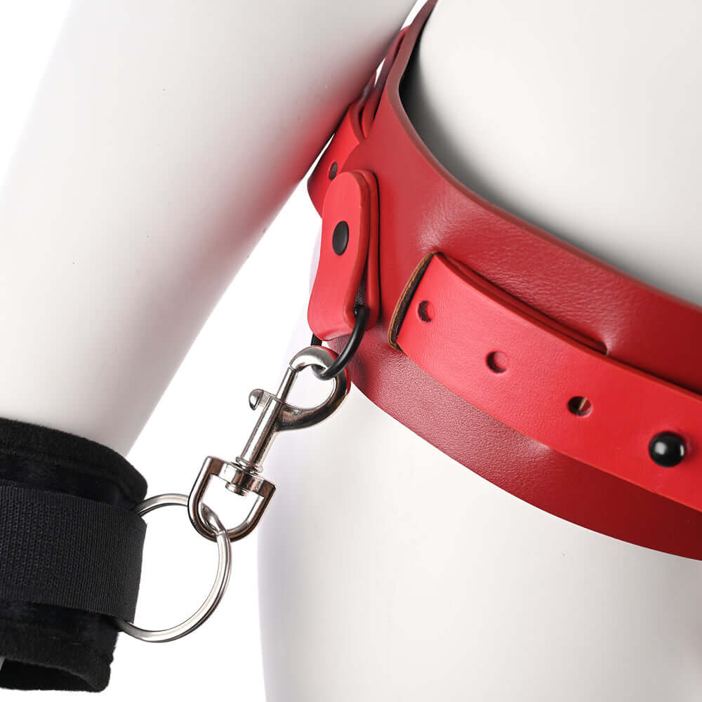 Sex & Mischief Exs & Ohs Bound and Belted restraint featuring sleek red faux leather design