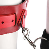 Close-up of the Sex & Mischief Exs & Ohs Bound and Belted with red faux leather and attachment clips.