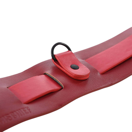 Close-up of the Sex & Mischief Exs & Ohs Bound and Belted restraint belt featuring red faux leather design.