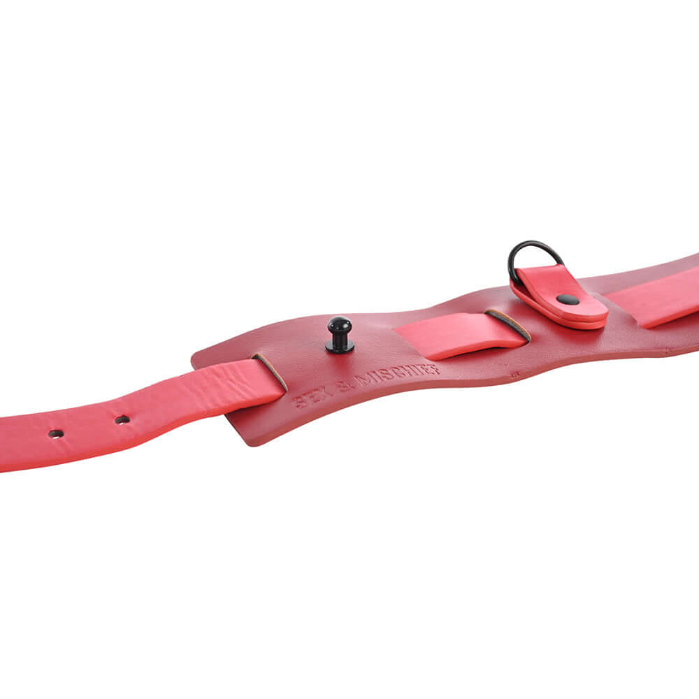 Sex & Mischief Exs & Ohs Bound and Belted faux leather restraint belt with red accents and versatile functionality.