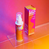 Love Me Tender Luscious & Heating Massage Oil Strawberry 3.3 Oz in a vibrant packaging, designed for intimate moments.