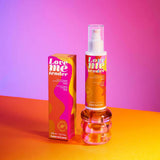 Love Me Tender Luscious & Heating Massage Oil Vanilla 3.3 Oz in a colorful packaging on a vibrant background.