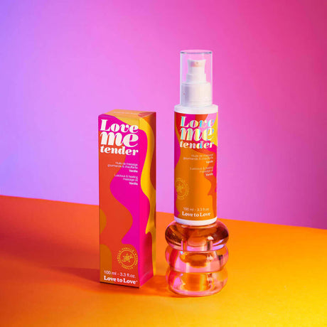 Love Me Tender Luscious & Heating Massage Oil Vanilla 3.3 Oz in a colorful packaging on a vibrant background.