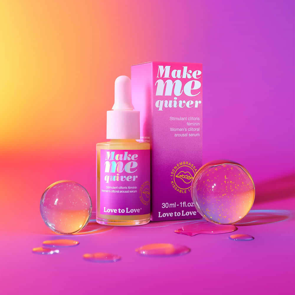 Love to Love Make Me Quiver Clitoral Arousal Serum 1 Oz in a vibrant packaging with colorful droplets and spheres.