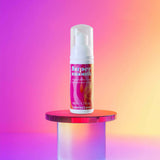 Love to Love Super Smooth Foaming Intimate Lubricant 1.7 Oz bottle on a colorful background