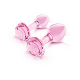 b-Vibe Glass Pink Roses Training Plug Set featuring pink glass plugs with rose-detailed bases.