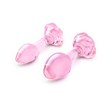 b-Vibe Glass Pink Roses Training Plug Set featuring sleek glass anal toys in dusty pink with rose bases.