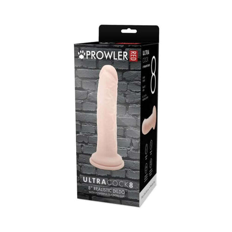 Prowler RED Ultra Cock 8 inch Realistic Dildo Vanilla packaging on display against a brick background.