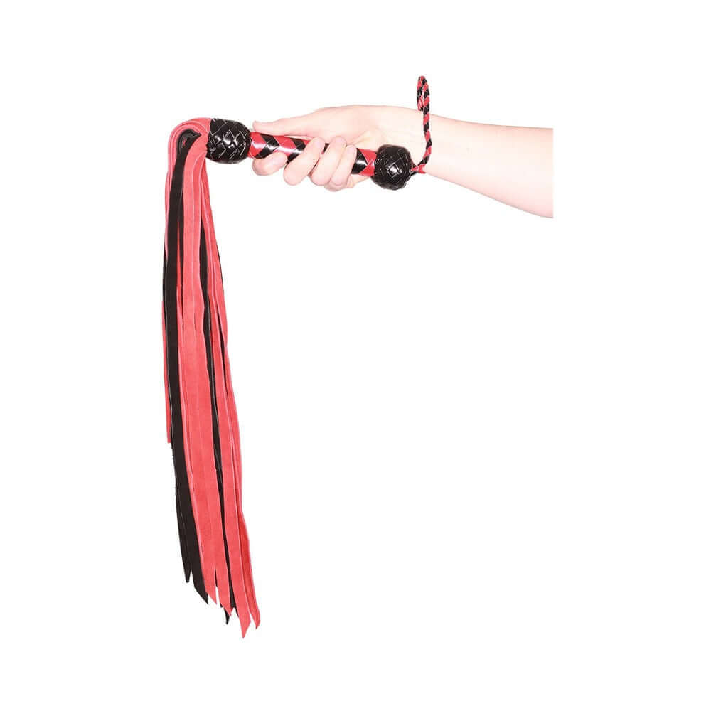 Prowler RED Flogger 33 inches Black Red held in hand, featuring bold black and red design for sensation play.
