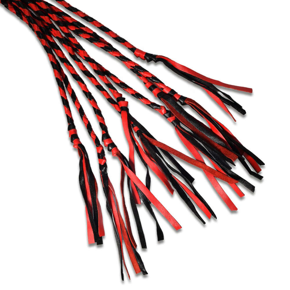 Prowler RED Long Handle Flogger Black Red flaunting black and red braids, perfect for impact play and control.
