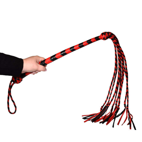 Prowler RED Long Handle Flogger Black Red held in hand for precision impact play.