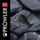 Prowler RED Weighted Butt Plug Black Large on textured stone background, highlighting its smooth tapered design.