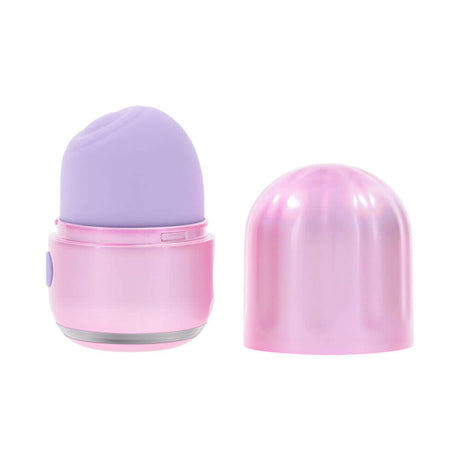 Evolved Vacation Vibes Tapping Massager in pink and purple with a stylish canister lid for discreet travel.