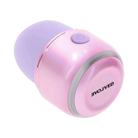 Evolved Vacation Vibes Tapping Massager in pink-pearl iridescent design, compact travel-friendly stimulator.