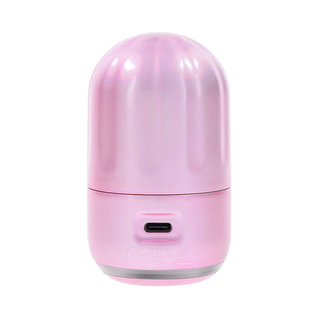 Compact pink-pearl iridescent Evolved Vacation Vibes Tapping Massager designed for discreet use and travel.