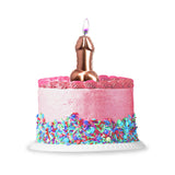 Pink Foil Penis Balloon Candle on a frosted pink cake with colorful sprinkles and a lit flame for celebrations.