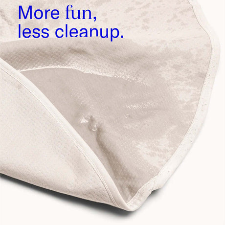 Dame Thro Waterproof Sex Blanket Oat showing soft, waterproof interior for easy cleanup and comfort during intimate moments.