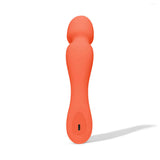 Dame Min Mini Wand Vibrator Papaya in vibrant orange color, designed for deep vibrations and compact for travel.