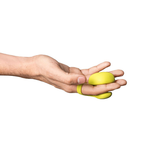 Dame Fin 2.0 Finger Vibrator Citrus held in a hand, showcasing its ergonomic design for enhanced pleasure.