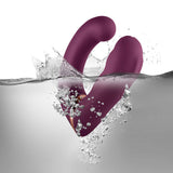 Rocks-Off Gemini Dual Stimulator Burgundy submerged in water, showcasing its dual-motor design and soft silicone texture.