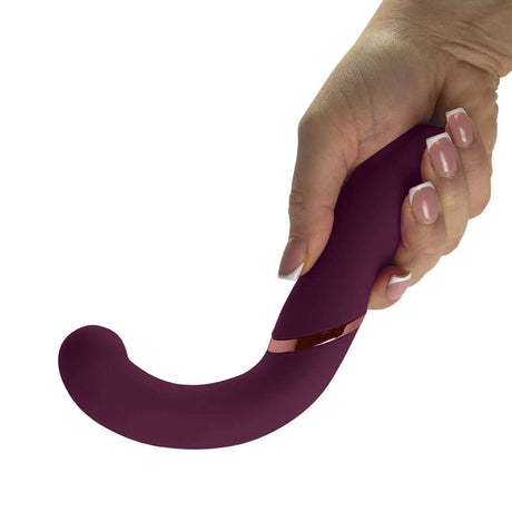 Rocks-Off Gemini Dual Stimulator Burgundy held in hand, showcasing its ergonomic design and sensual texture.