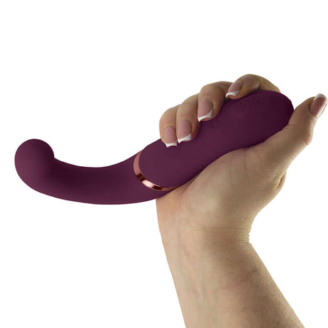 Rocks-Off Gemini Dual Stimulator Burgundy held in hand, showcasing its elegant design and dual motor features.
