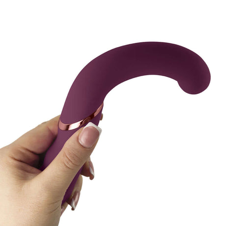 Rocks-Off Gemini Dual Stimulator Burgundy held in hand showcasing its ergonomic design.