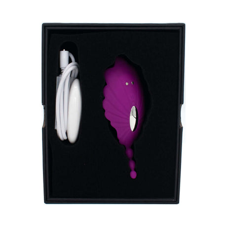 Shell Yeah Remote Controlled Wearable Panty Vibrator in a box with charging cable, designed for discreet stimulation.