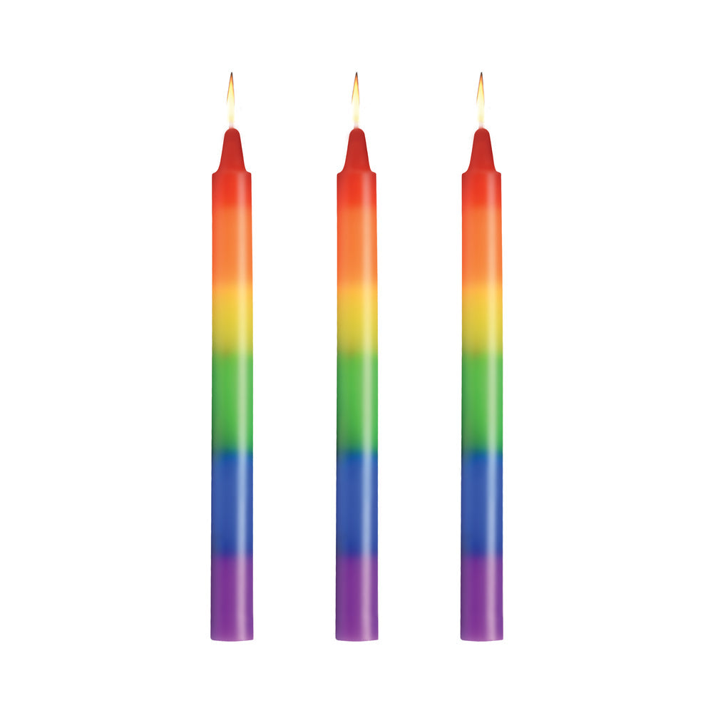 Master Series Pride Candles Rainbow Drip Candle Set of 3 featuring vibrant rainbow colors and lit wicks.
