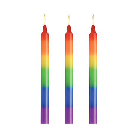 Master Series Pride Candles Rainbow Drip Candle Set of 3 featuring vibrant rainbow colors and lit wicks.
