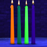 Master Series Glow Wax UV Blacklight Reactive Drip Candles Set of 4 featuring orange, green, blue, and purple colors.