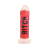 Master Series BITCH Silicone Dildo in vibrant red with bold lettering, designed for intense pleasure and fantasy fulfillment.