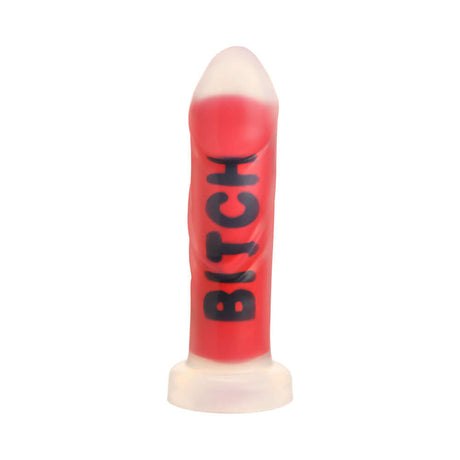 Master Series BITCH Silicone Dildo in vibrant red with bold lettering, designed for intense pleasure and fantasy fulfillment.