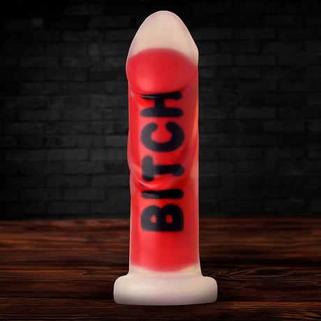 Master Series BITCH Silicone Dildo in bold red with textured surface, designed for intense pleasure and psychological play.
