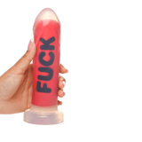 Hand holding the Master Series FUCK Silicone Dildo, showcasing its bold design and vibrant color.