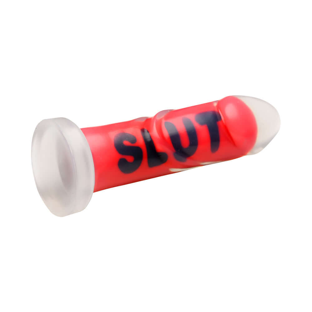 Master Series SLUT Silicone Dildo in vibrant red with SLUT text, designed for intense pleasure exploration.