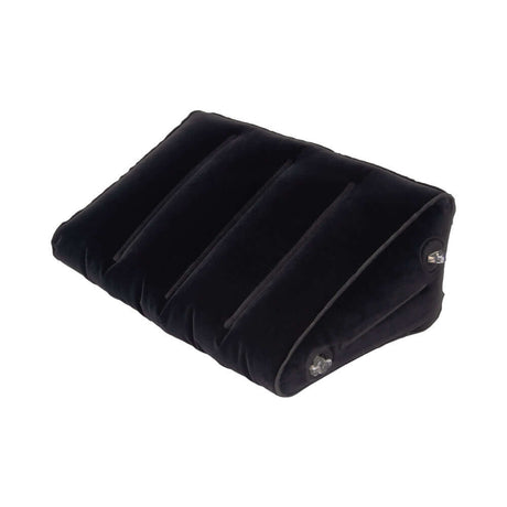 Lux Fetish Inflatable Position Wedge with Detachable Cuffs on a black velvet surface for enhanced comfort and support.
