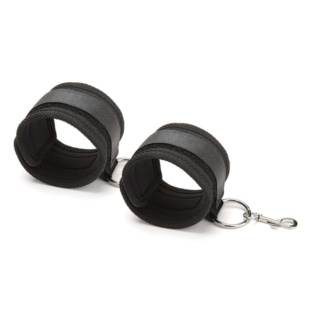 Lux Fetish Inflatable Position Wedge with Detachable Cuffs in black, showcasing the cuffs designed for versatile play.