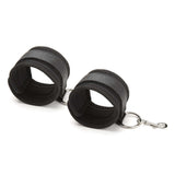 Lux Fetish Inflatable Position Wedge with Detachable Cuffs in black, showcasing the cuffs designed for versatile play.