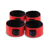 Lux Fetish Webbed Up Bedspreader Restraint System red cuffs for secure bondage play.