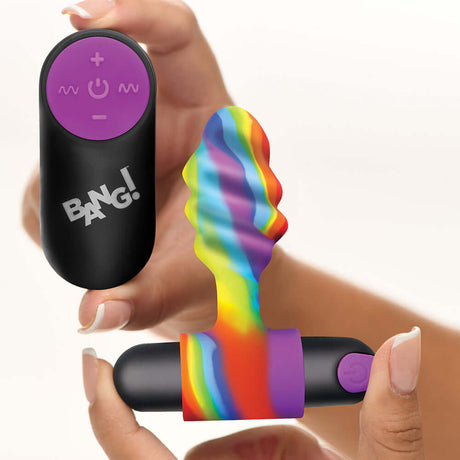 BANG Vibrating Rainbow Butt Plug with remote control, showcasing its vibrant colors and textured design.