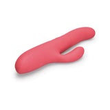 Le Wand Thrust Rabbit Vibrator in soft pink silicone for dual stimulation and intimate pleasure.