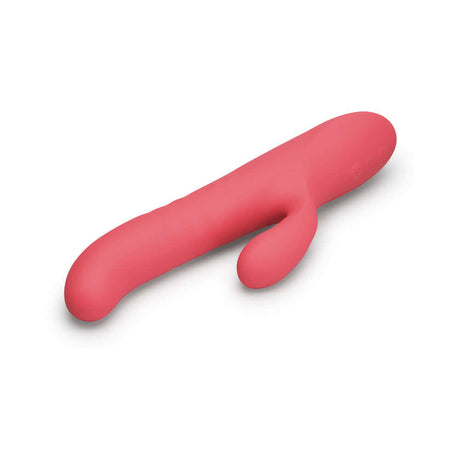 Le Wand Thrust Rabbit Vibrator in sleek pink design for dual stimulation and pleasure.