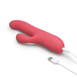 Le Wand Thrust Rabbit Vibrator in pink, featuring USB charging and designed for dual stimulation.
