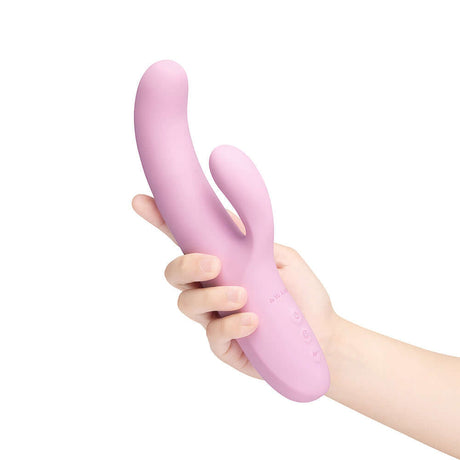 Le Wand Hither Rocking Rabbit Vibrator held in hand, showcasing its premium dual-stimulation design and curved shape.