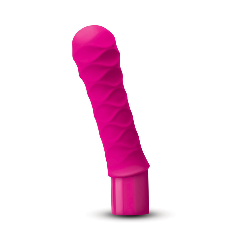 The Cowgirl Saddle Machine Black in vibrant pink with a textured design for enhanced pleasure.