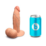 b-Vibe Slipskin Realistic Silicone Dildo 6 inch Girthy Mocha next to a soda can for size comparison.