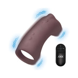 JOCK Vibrating Silicone Penis Sleeve Dark with remote control showing multiple vibration settings.